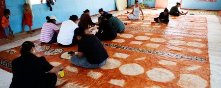 Tapa cloth being made in a hall on 'Eua island